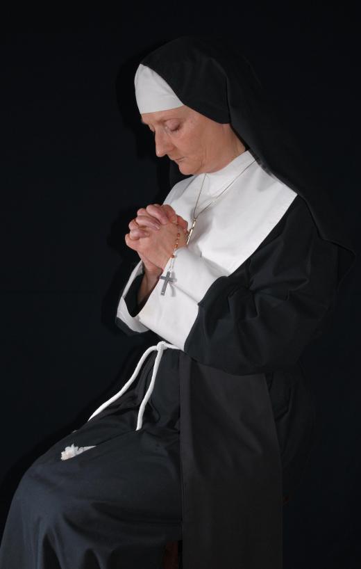 Many nuns will hold a rosary when they pray.