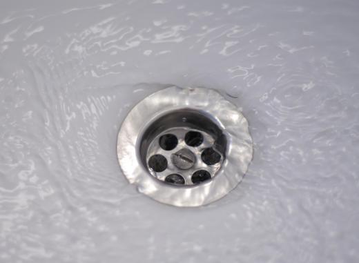 The phrase "down the drain" implies that something has been lost, as in it has gone down a drain and is unrecoverable.